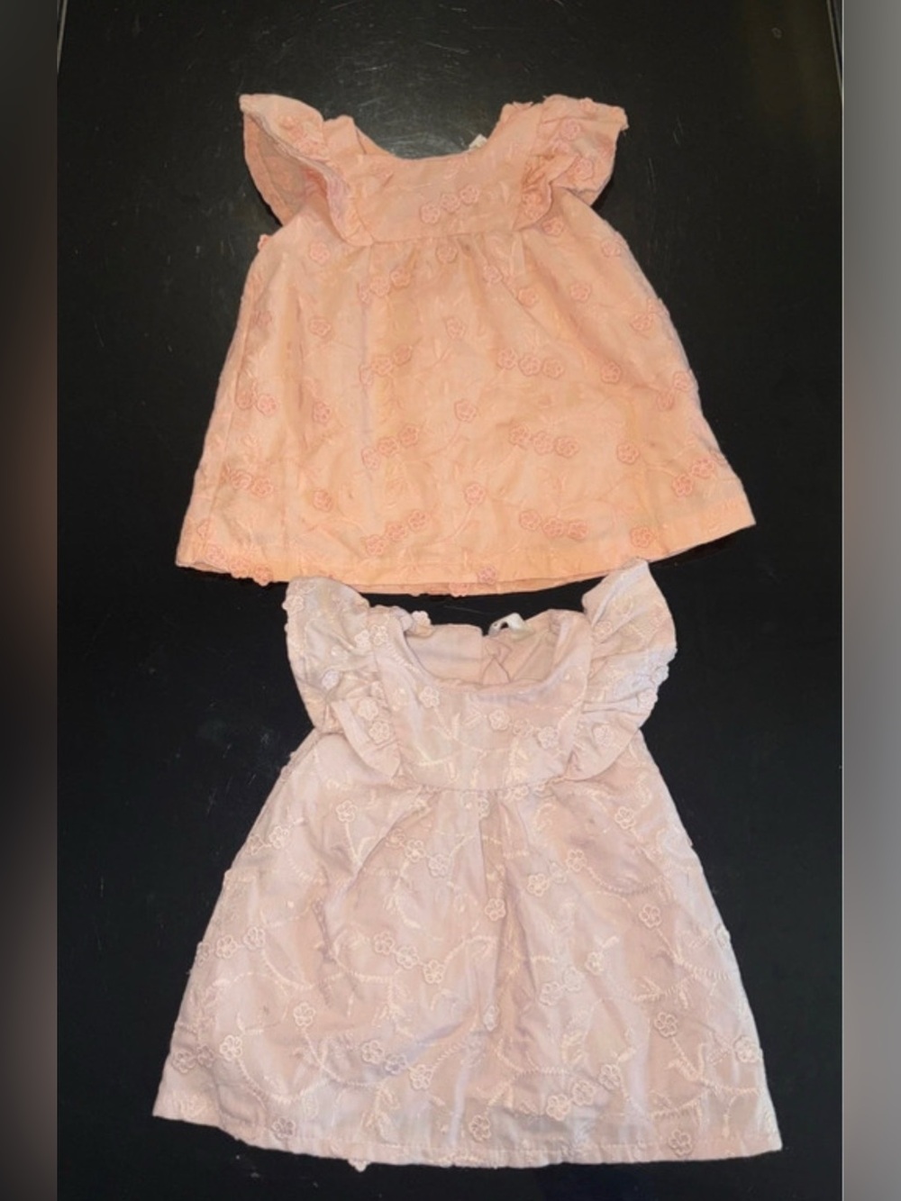 two baby dresses snug size 0-3 M...